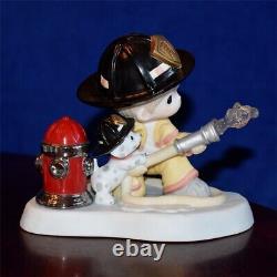 2011 Precious Moments COURAGE UNDER FIRE 11201 Firefighter with Hose RARE
