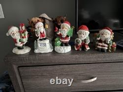 5- Precious Moments Santa's