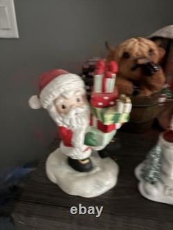 5- Precious Moments Santa's