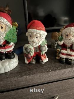 5- Precious Moments Santa's