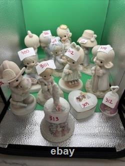 Lot 12 of precious moments figurines