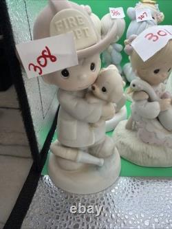 Lot 12 of precious moments figurines