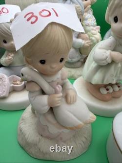 Lot 12 of precious moments figurines