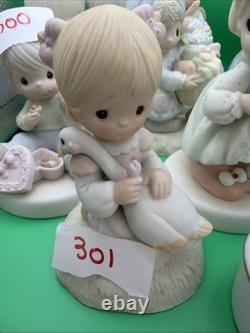 Lot 12 of precious moments figurines