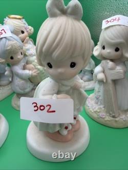 Lot 12 of precious moments figurines