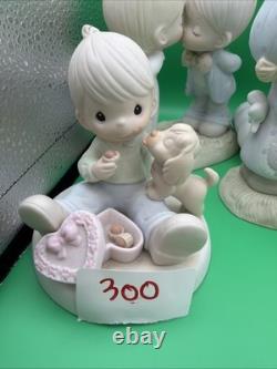 Lot 12 of precious moments figurines