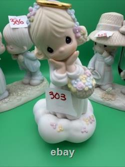 Lot 12 of precious moments figurines