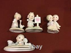 Precious Moments 2 Dolls, 37 Figurines, and 3 Plates Lot of 42 Pieces