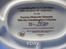 Precious Moments A GRANDDAUGHTER IS A LIFE FILLED WITH MOMENTS OF HAPPINESS A015