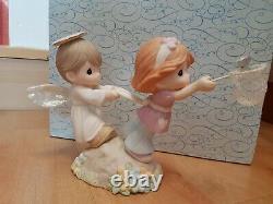 Precious Moments Chapel Exclusive Figurine Held by the Hands of Faith