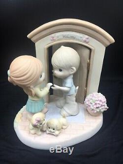 Precious Moments Hands Build Houses, Hearts Build Homes Figurine