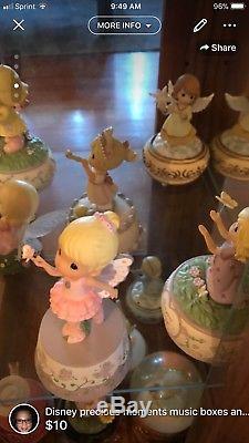 Precious moments lot of 25 disney music boxes, globes, and miscellaneous figurin
