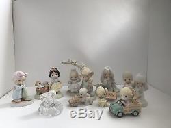 Precious moments lot of figurines including Walt Disney show case and crystal