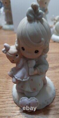 Set of 16 Precious Moments Growing In Grace birthday girl Porcelain Figurines
